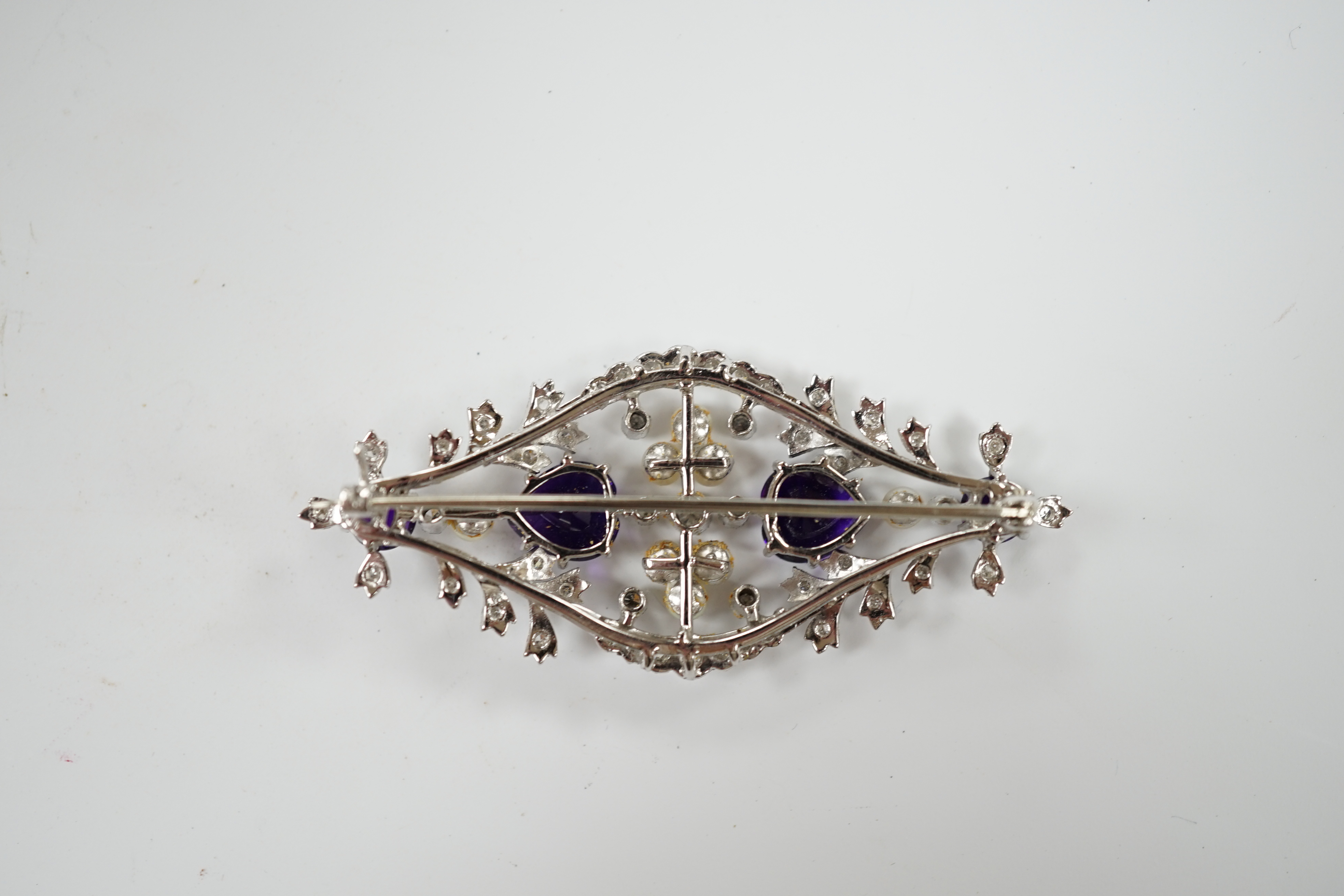 A white metal, diamond, cultured pearl and amethyst cluster set openwork brooch, 62mm, gross weight 16 grams.